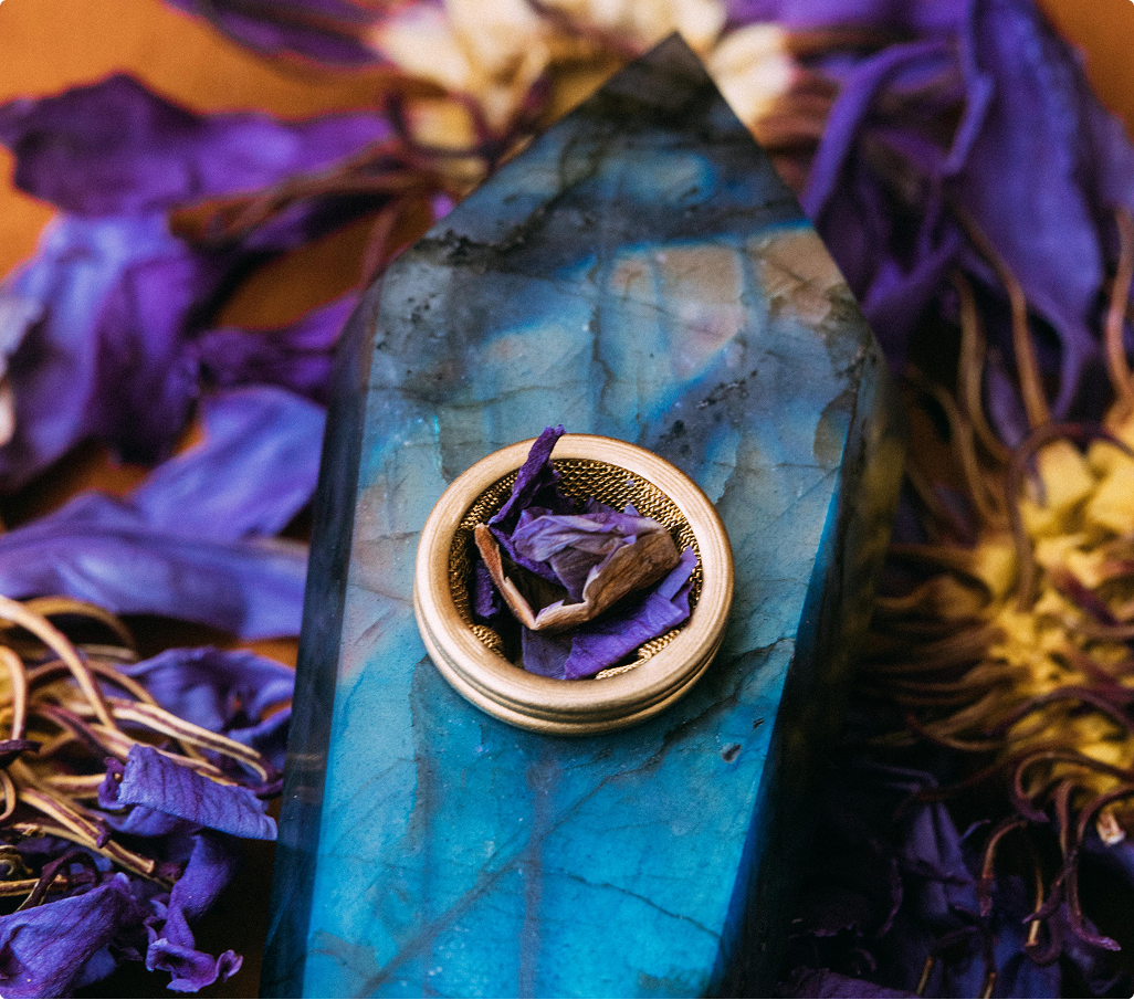 Labradorite pipe resting among Blue Lotus flowers