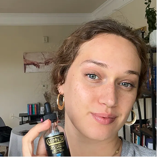 Customer holding Ritual Oils